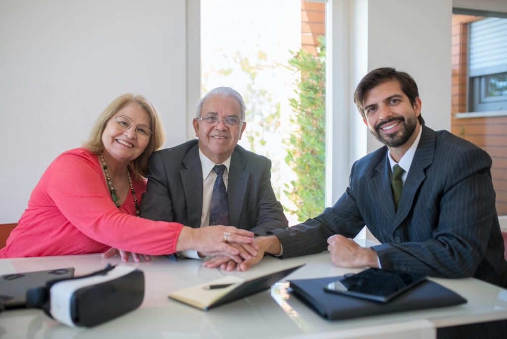 Three Business People Cooperating With One Another